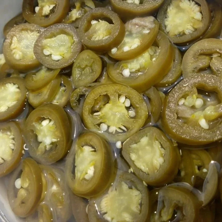 Sliced Green Jalapeno pepper preserved in brine ready for eat as appetizer  made in Egypt all packages you need