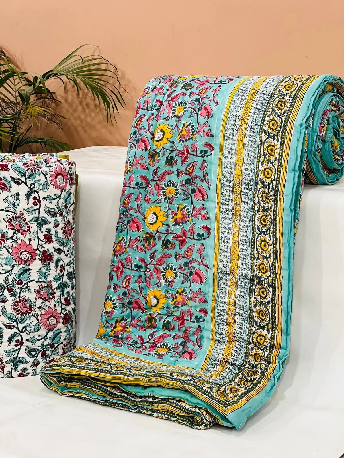 custom made 100% cotton quilts in different designs & various sizes on blue base fabric & multi colour print.