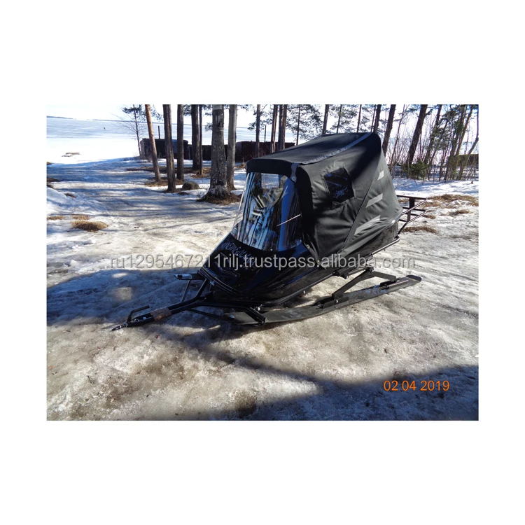 Snow-mobile trailer passenger with framed windshield seat cushion hatch for snow and garbage removal for sale