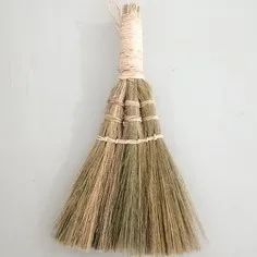 Small soft-bristled broom used to sweep dust in the house
