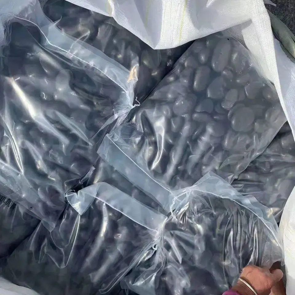 Polished river rocks black pebble stone for landscaping, river pebbles