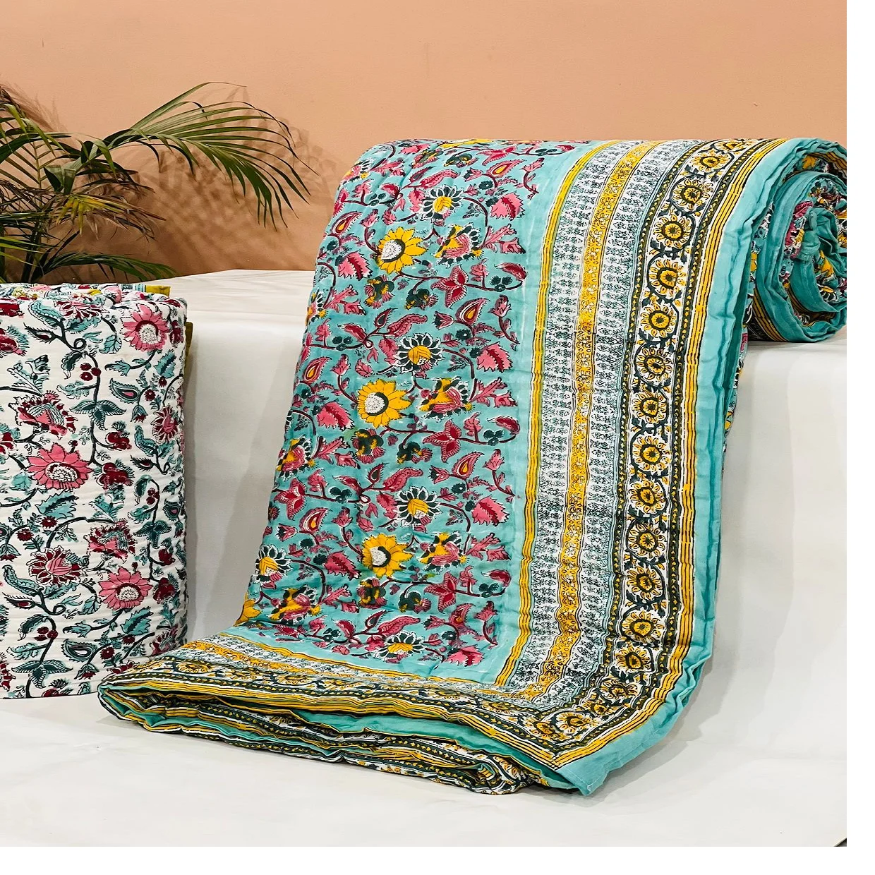 custom made 100% cotton quilts in different designs & various sizes on blue base fabric & multi colour print.