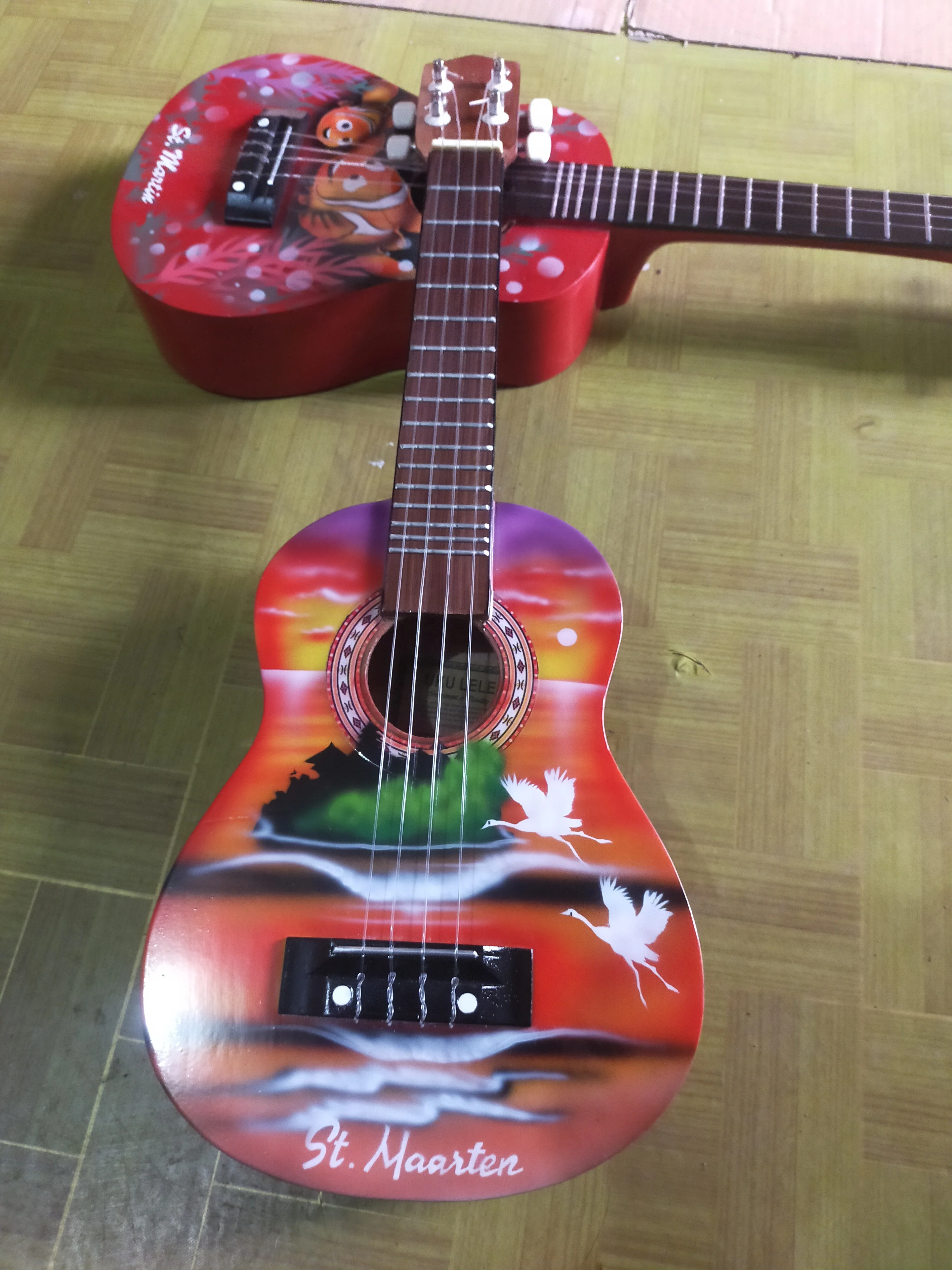 Nice product customized logo and design wholesale available in may colors wooden Bali cheap Ukulele