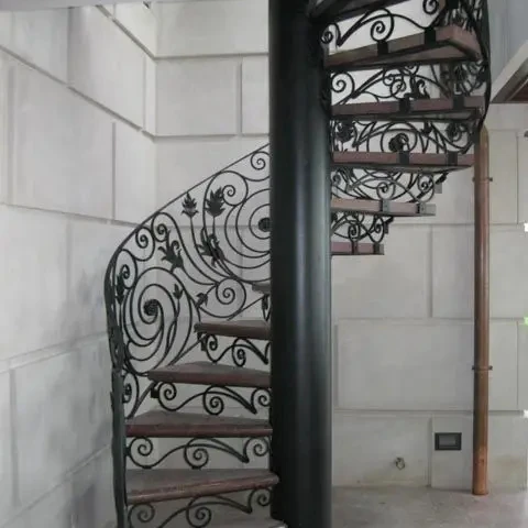 Foshan Durable Stairs Carbon Steel Beam Spiral Staircase with Wrought Iron Guardrails Wooden Tread Customized Interior Stairs