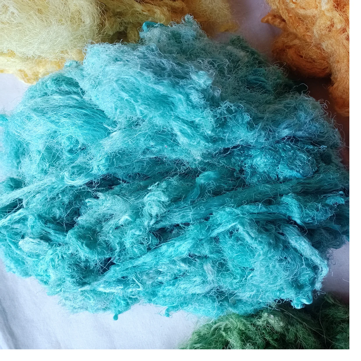 Custom made sari silk waste fiber dyed in custom dyed colors suitable for yarn and fiber stores ideal for resale in blue colour