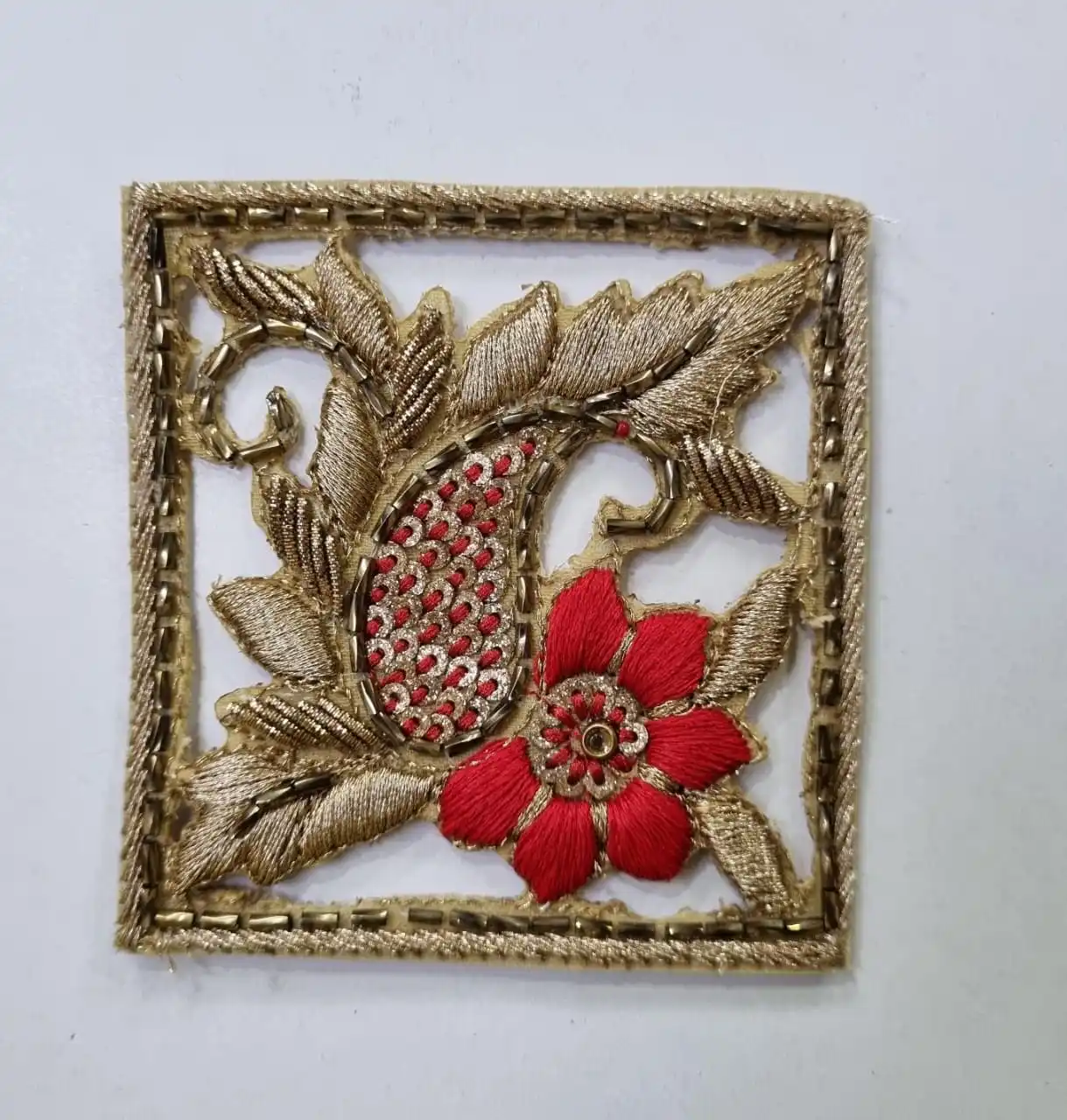 custom made embroidered patches with floral patterns including bead work and gold thread for dress designers