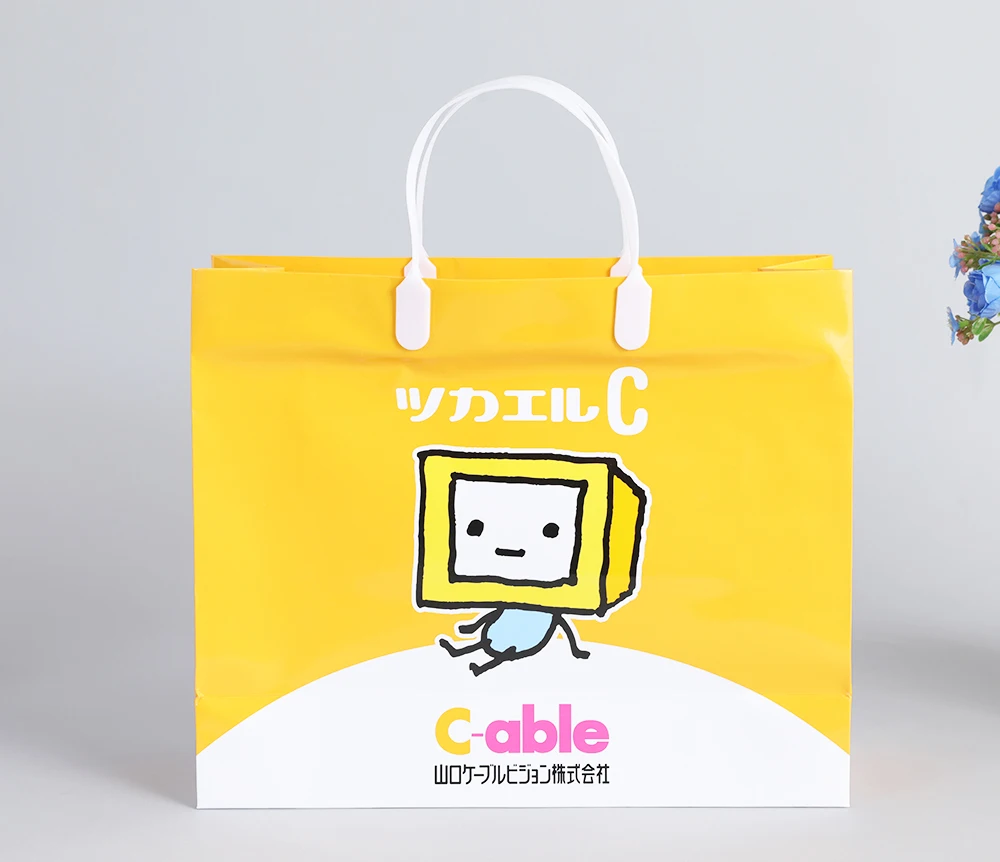 Customize machine making recyclable Orange cloth electronics pharmacy shopping carry paper bag with logo pvc handle