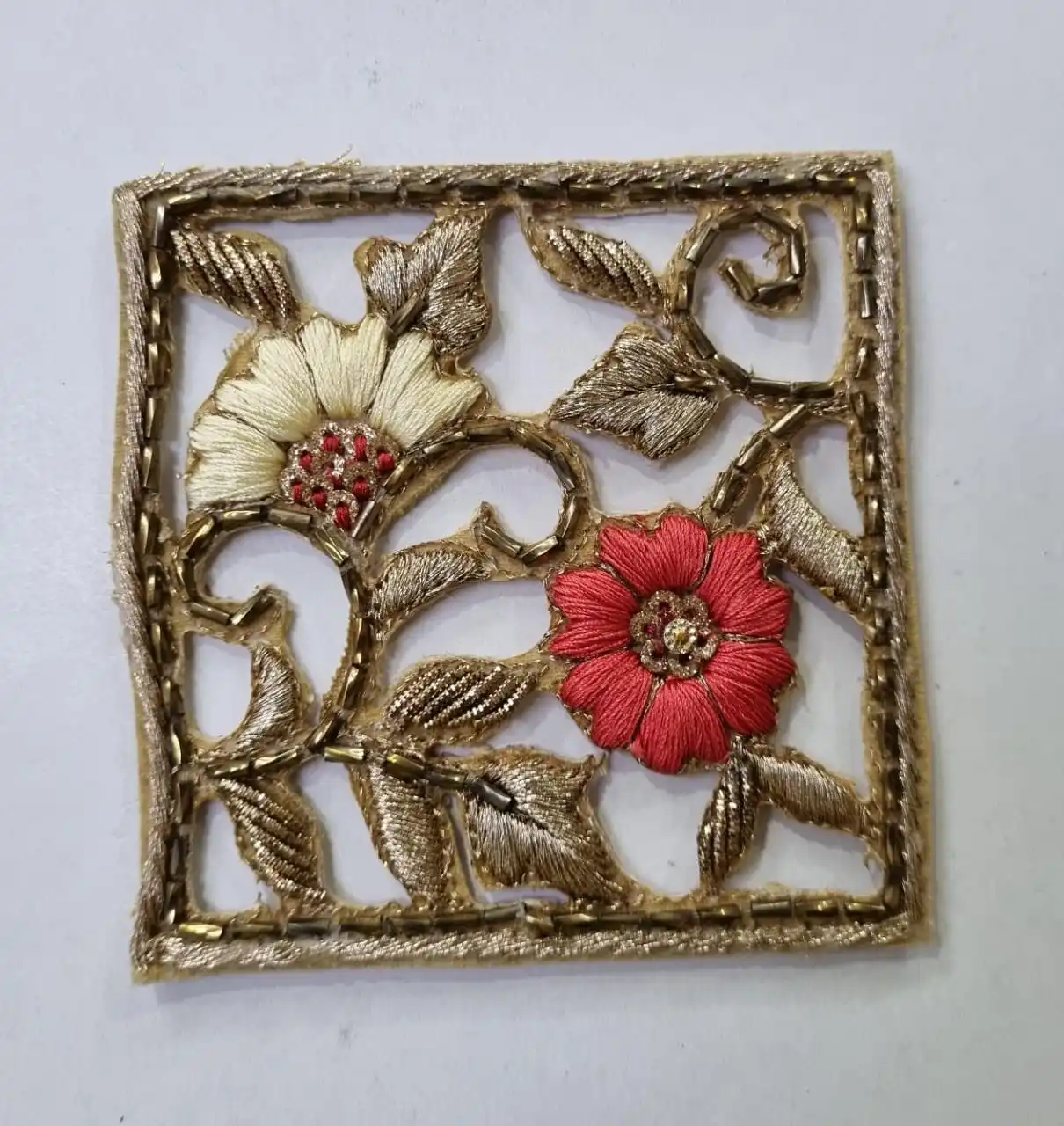 custom made embroidered patches with floral patterns including bead work and gold thread for dress designers