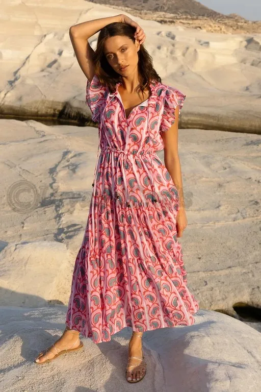 Made from a lightweight cotton voile Fully lined Pullover style Adjustable ties at the waist Flutter cap sleeves