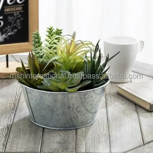 Artificial succulent arrangement with galvanized metal planter this rustic planter faux succulent arrangement makes it easy to