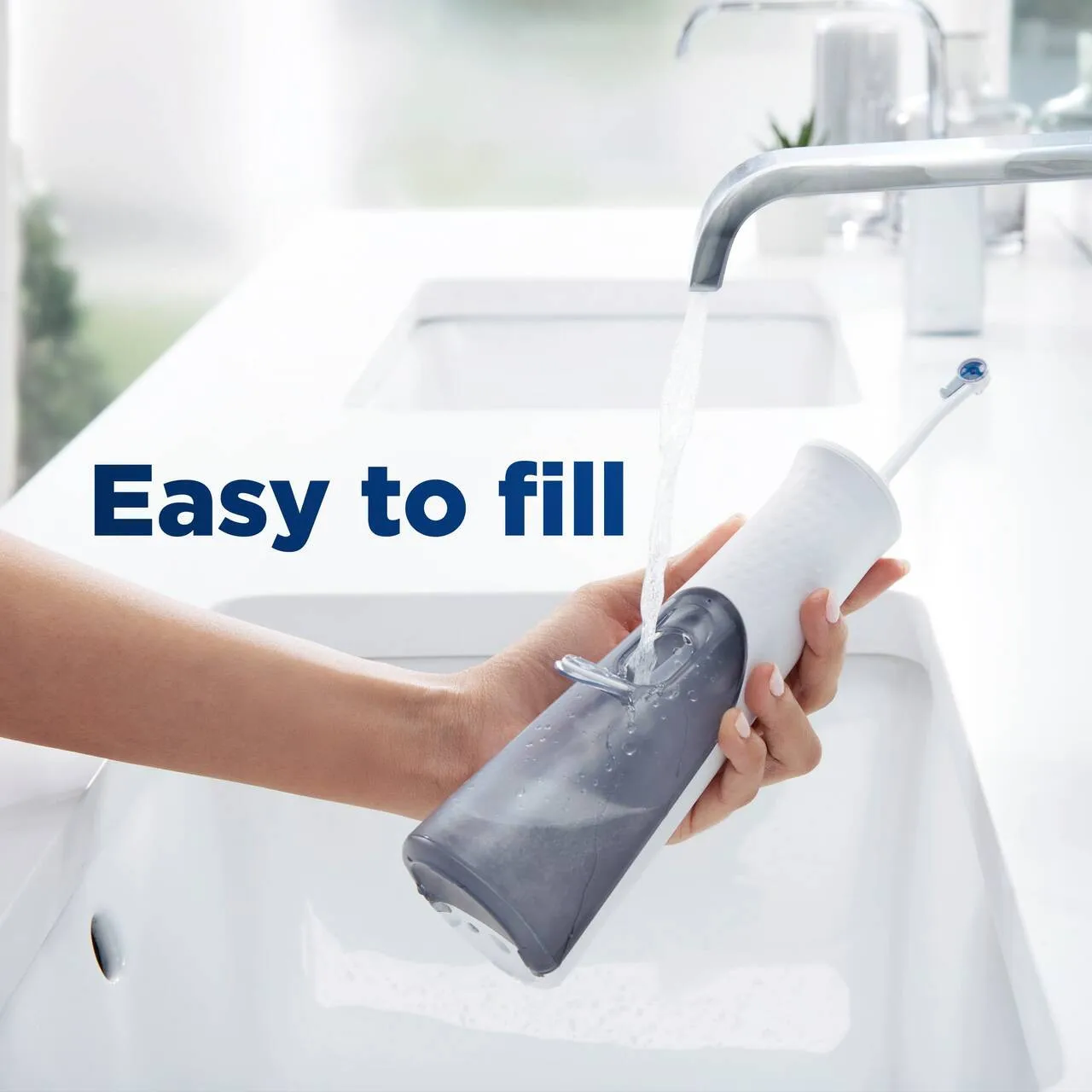 Oral-B Water Flosser, Oral Irrigator Handle with 4 Nozzles, White & Light Blue