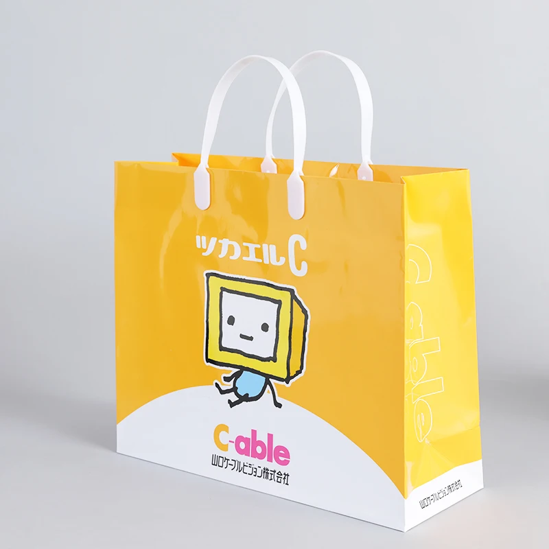 Customize machine making recyclable Orange cloth electronics pharmacy shopping carry paper bag with logo pvc handle