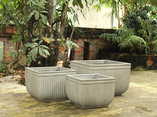 Set of 3 beautifully designed high quality concrete plant pots used to decorate your living space