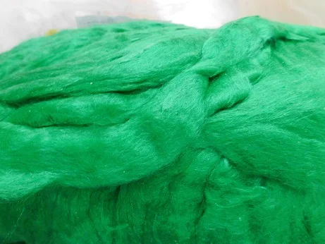 custom made bright green colored sari silk sliver made from the finest mulberry silk roving ideal for textile spinners