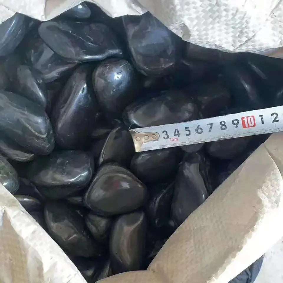 Polished river rocks black pebble stone for landscaping, river pebbles