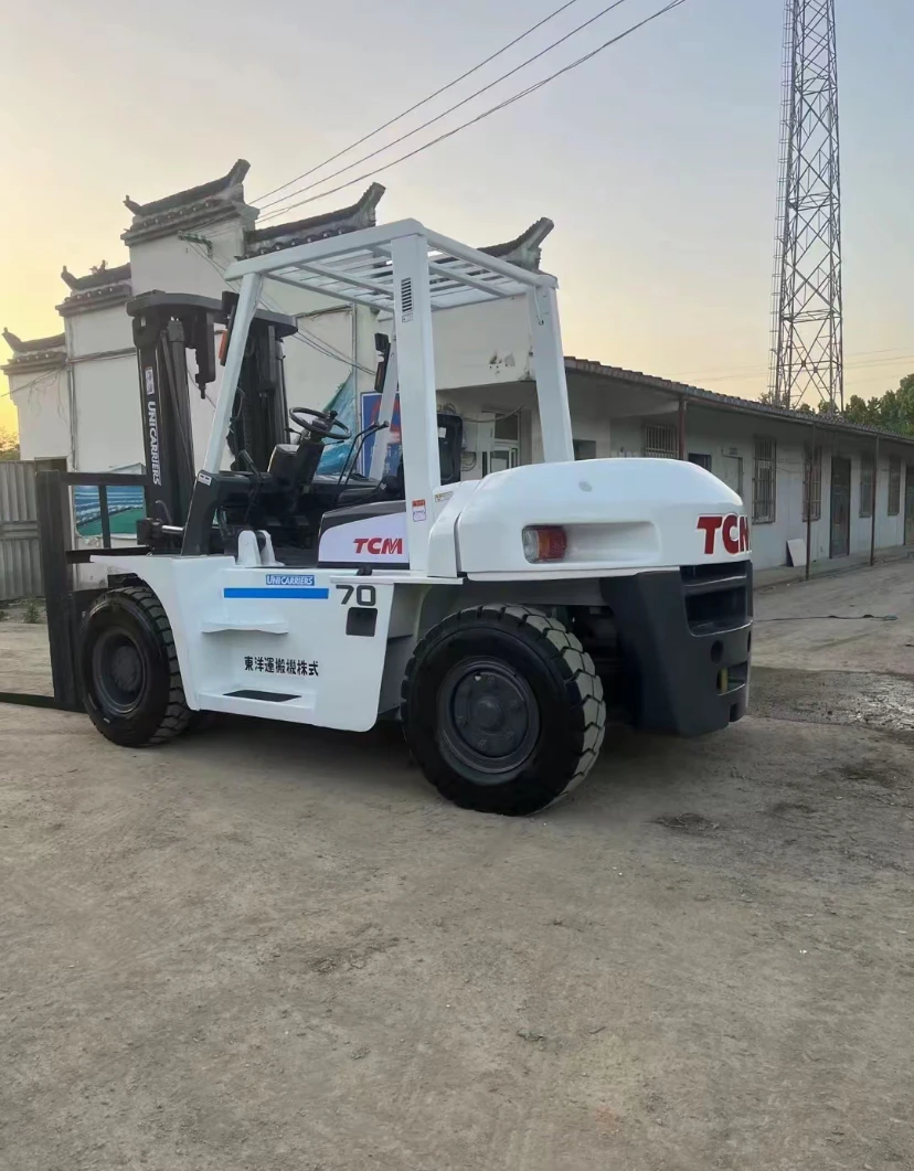 Second hand TCM 7ton forklift good condition for sale made in Japan Isuzu engine White Orange Transporting Used TCM forklifts