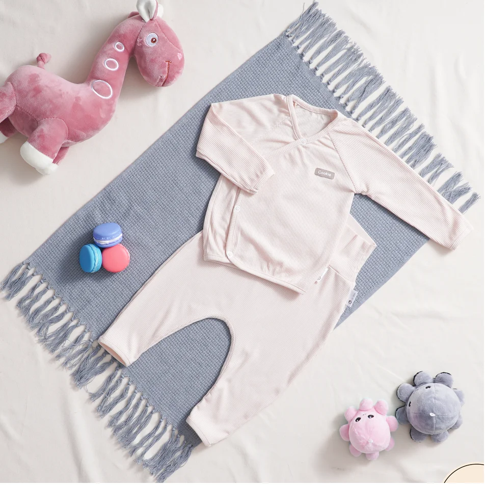 95% cotton Unisex Vietnam Newborn Set with a long sleeve cross front top & high-waistband pants (not including accessories)