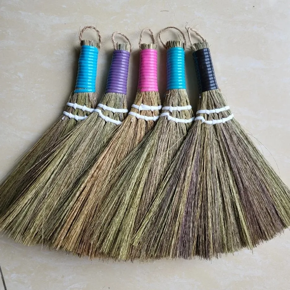 Small soft-bristled broom used to sweep dust in the house