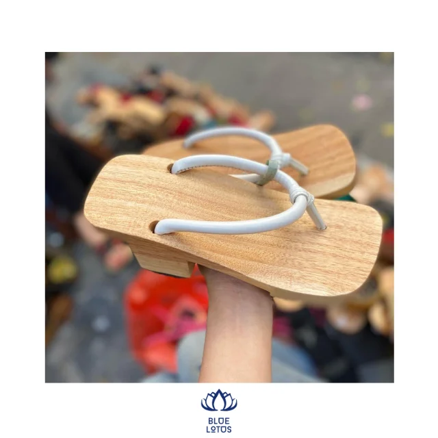 Guoc Moc or wooden clogs are traditional footwear for males and females in Vietnam.