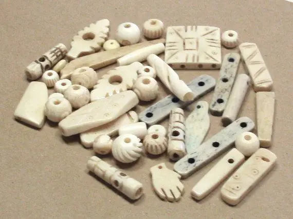 hand carved bone beads in assorted sizes with holes for jewelry designers and bead stores Buffalo Camel Ox Bone Beads