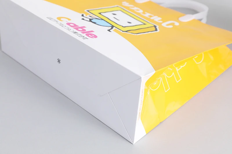Customize machine making recyclable Orange cloth electronics pharmacy shopping carry paper bag with logo pvc handle
