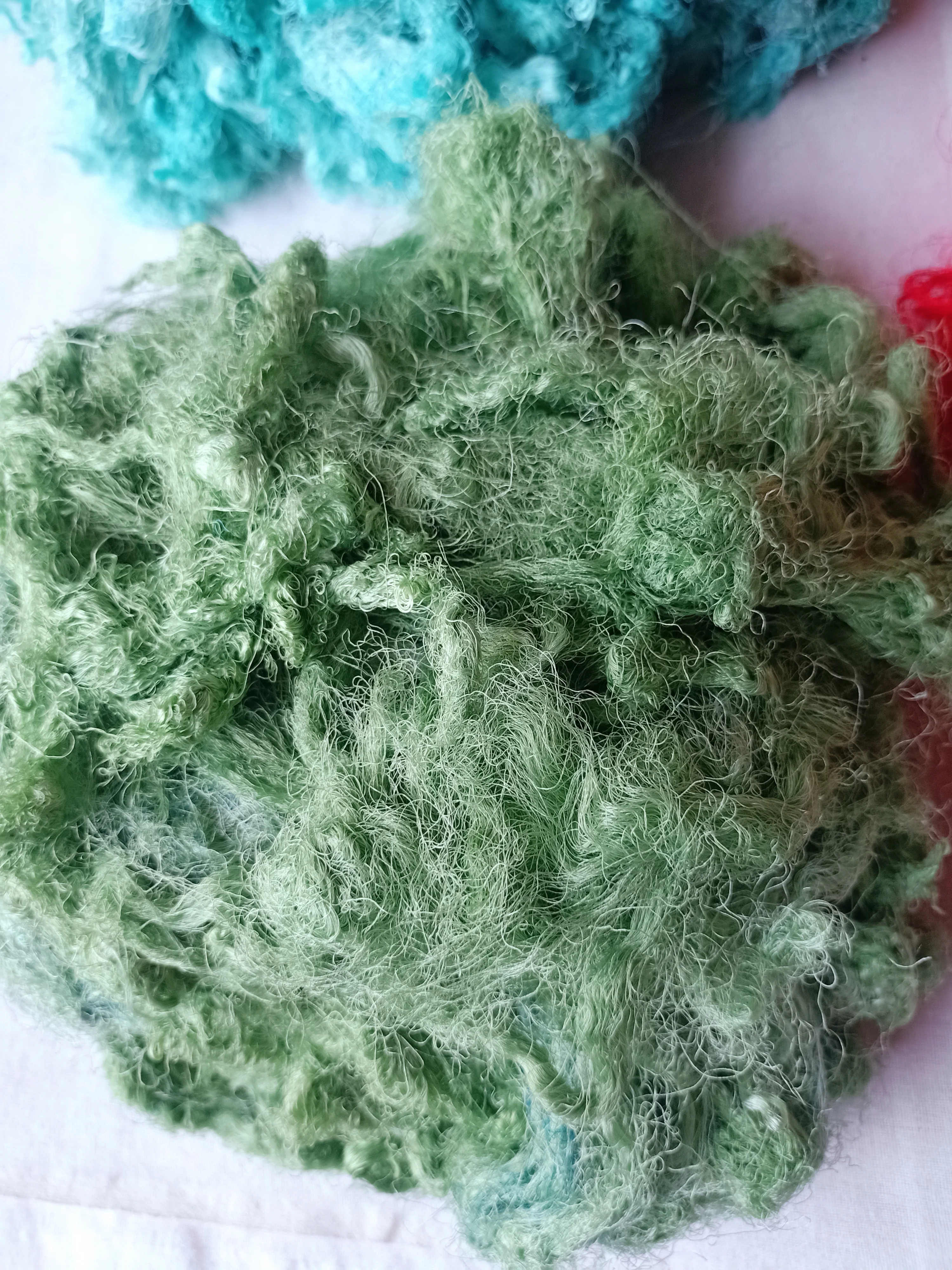 Custom made sari silk waste fiber dyed in custom dyed colors suitable for yarn and fiber stores ideal for resale in blue colour