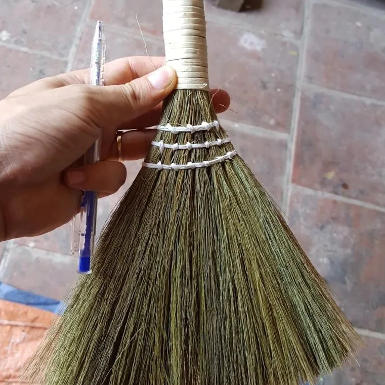 Small soft-bristled broom used to sweep dust in the house