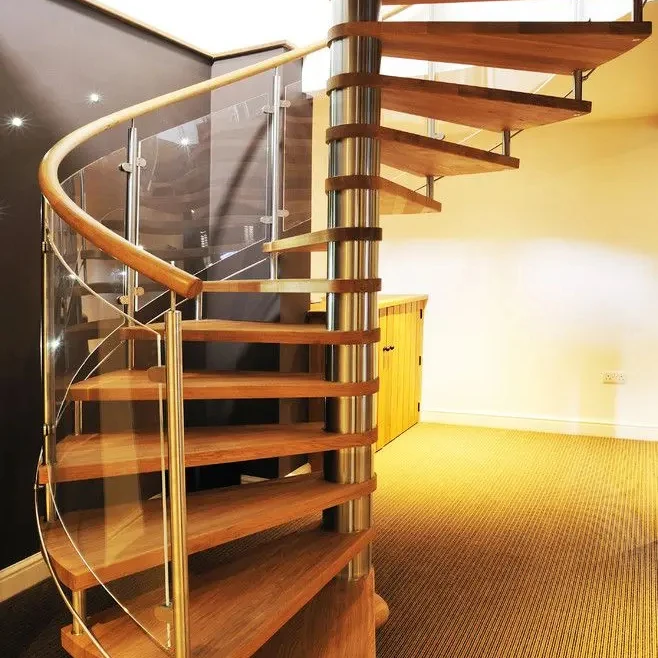 Foshan Durable Stairs Carbon Steel Beam Spiral Staircase with Wrought Iron Guardrails Wooden Tread Customized Interior Stairs