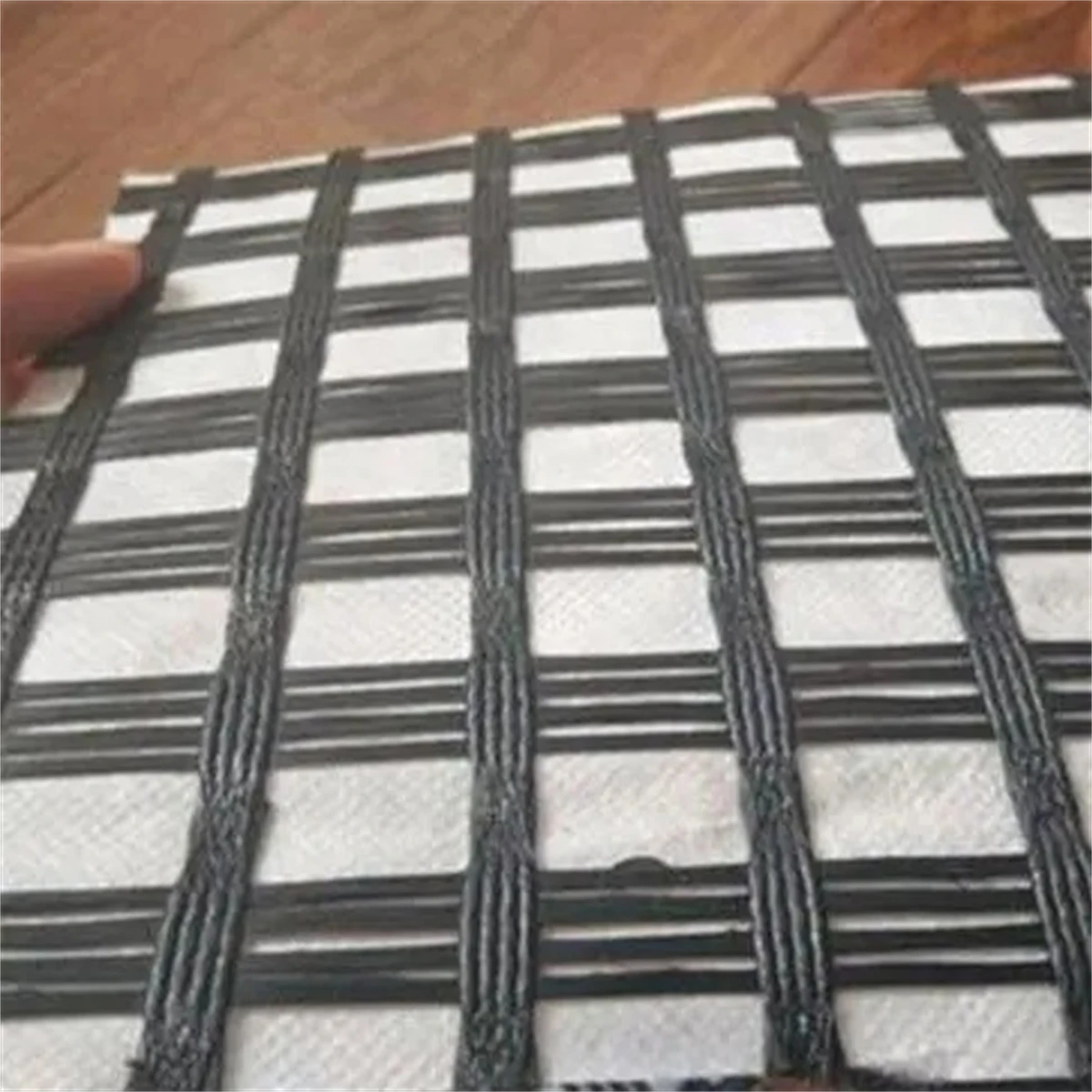 Low Factory Price composite geogrid PET polyester geogrid composite non-woven geotextile fiberglass Dacron composite geogrid