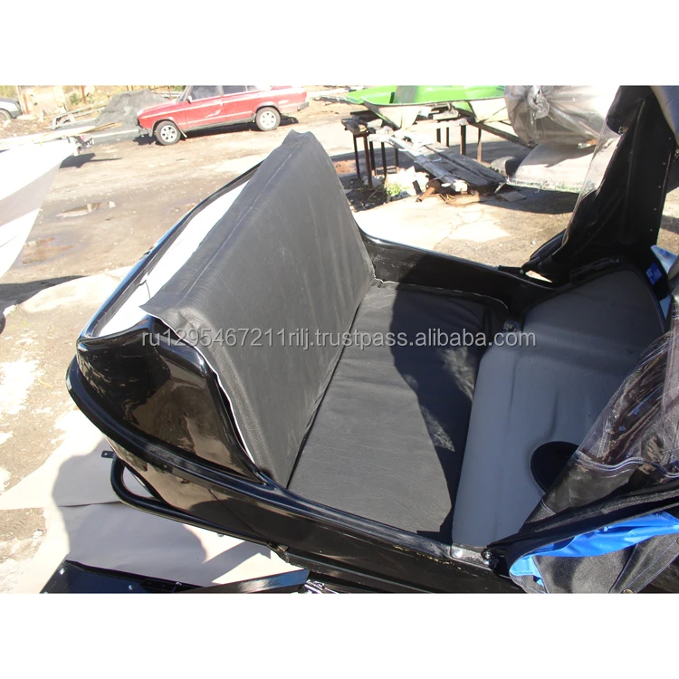 Snow-mobile trailer passenger fiberglass body mounted on steel frame of the suspension system and awning device