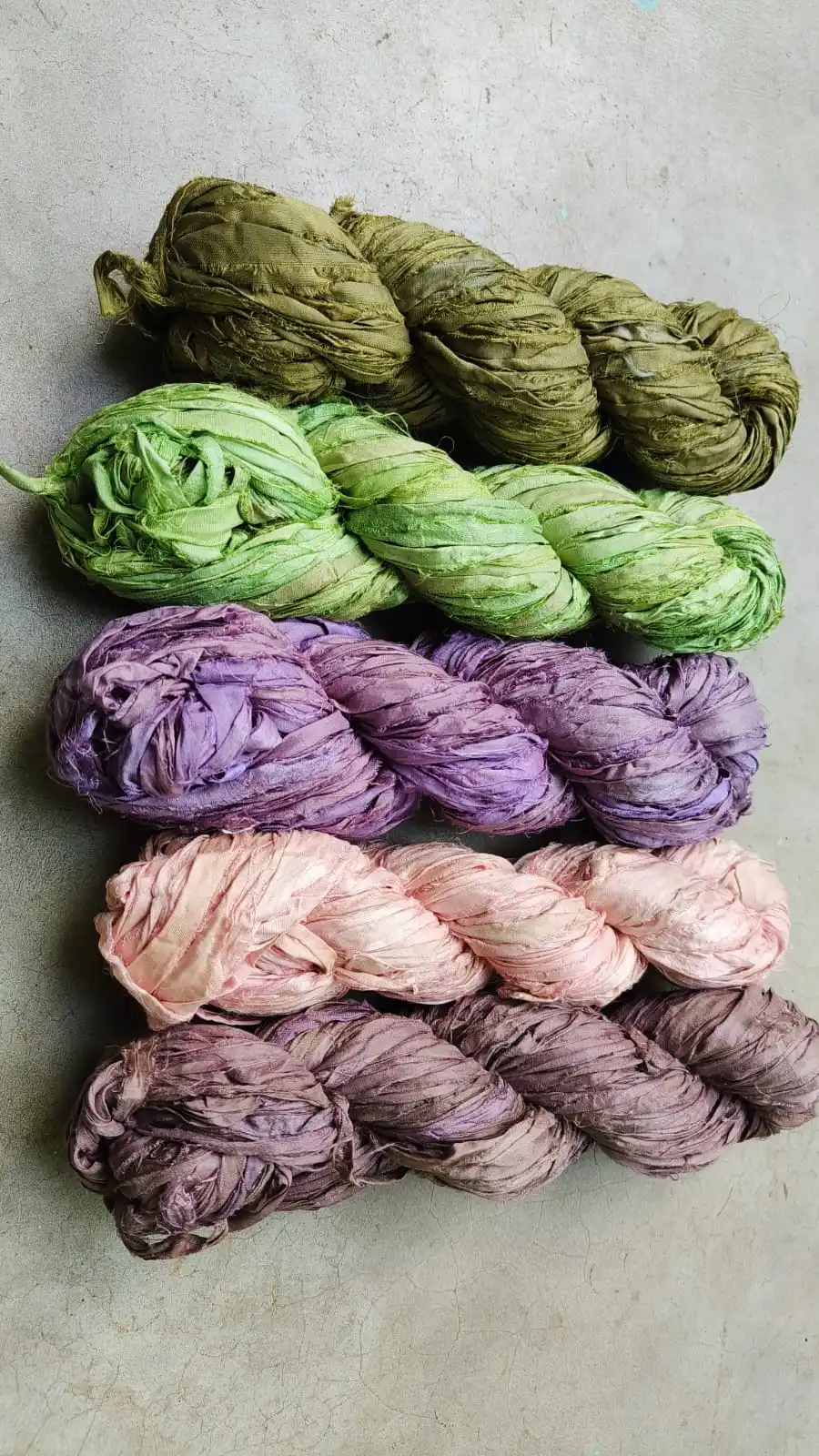 custom made sari silk ribbon yarns in assorted colors made from recycled sari silk fabrics in 100 gram skeins