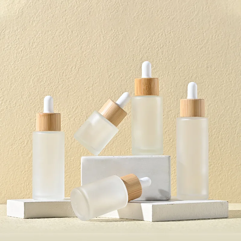 Custom Logo Printed Frost Glass Bottle with Flat Shoulder Serum Empty Clear Dropper Cylinder Shape 15ml 30ml 100ml Capabilities