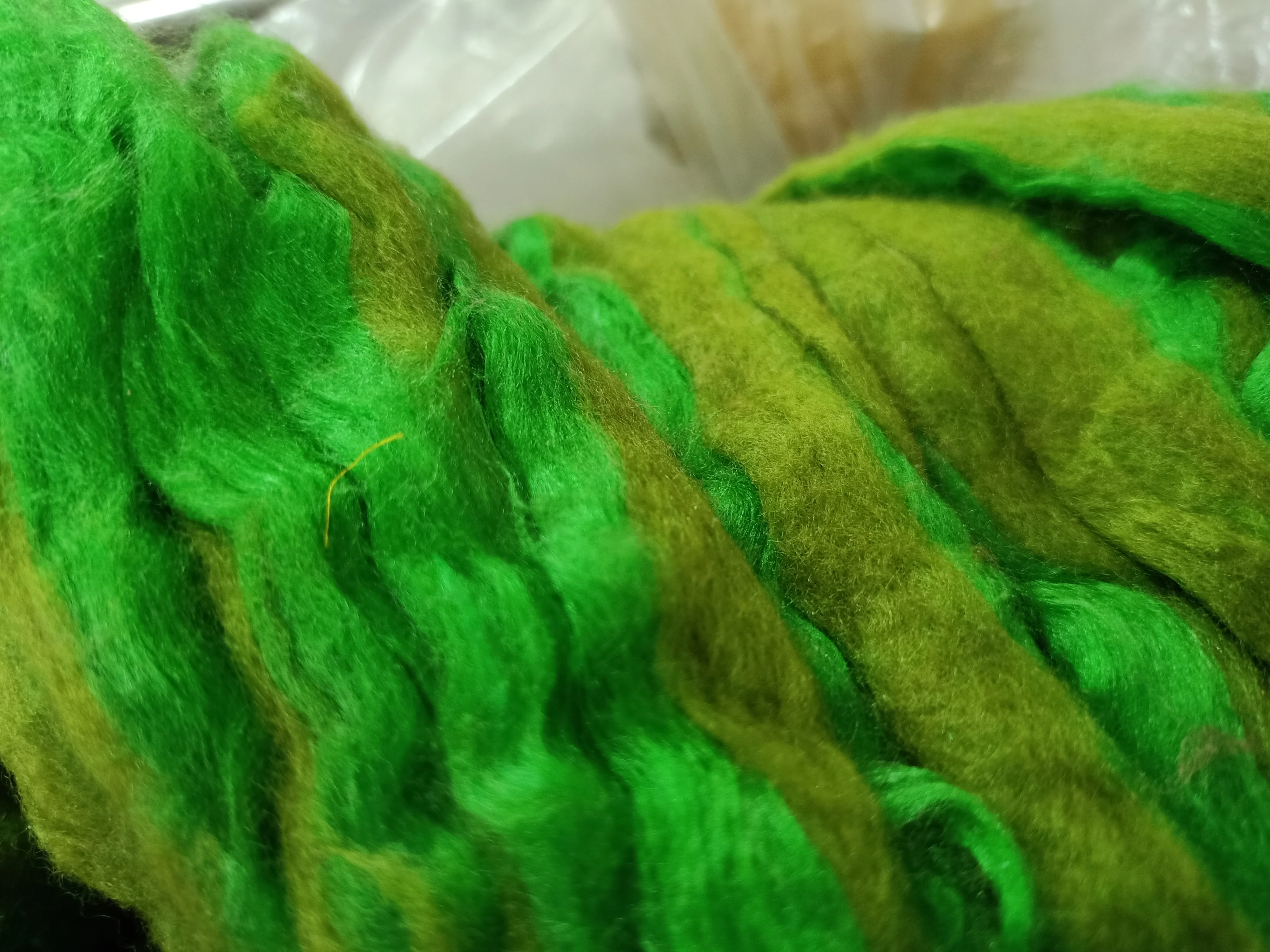 custom made bright green colored sari silk sliver made from the finest mulberry silk roving ideal for textile spinners
