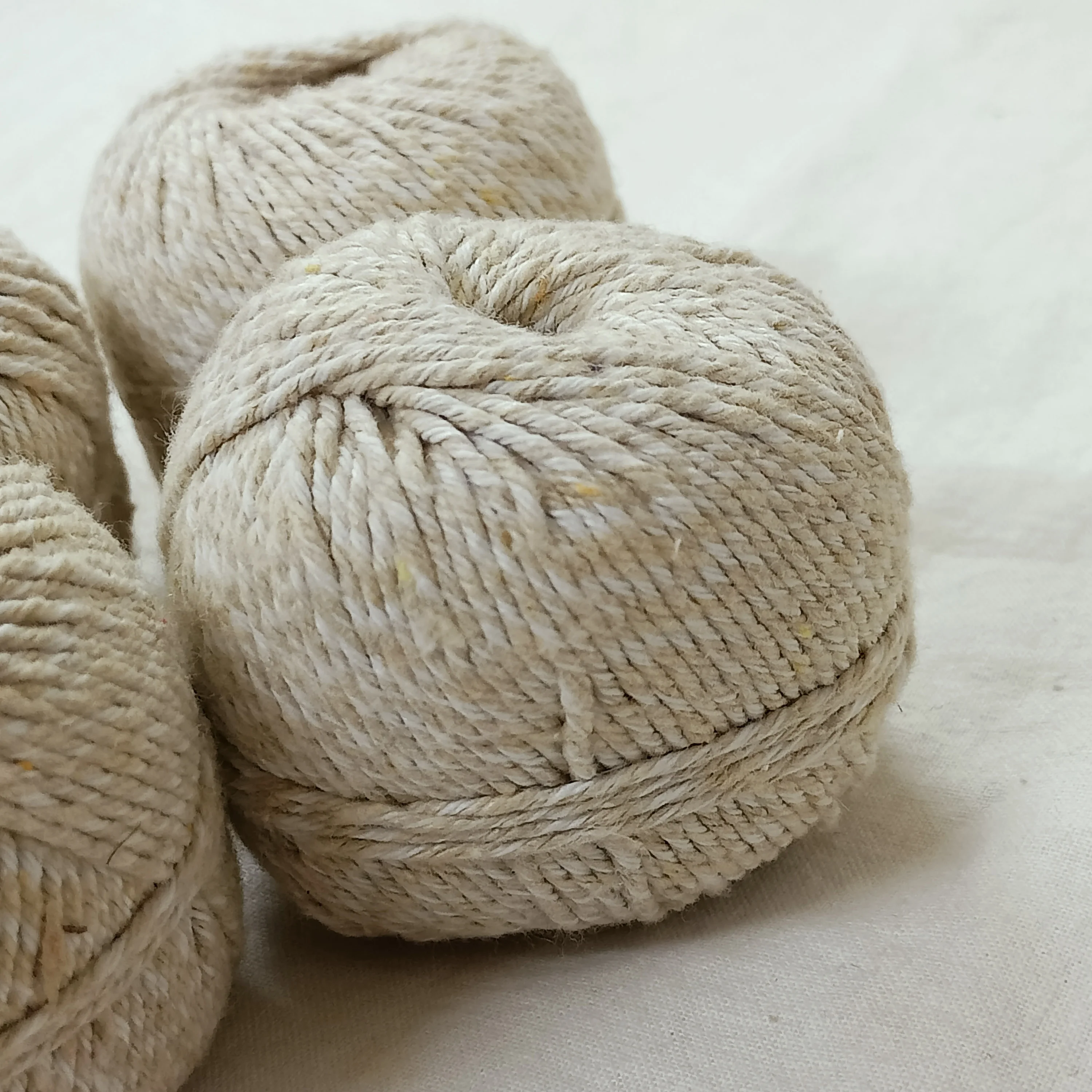 natural nettle fiber yarn  made with bleached and unbleached fibers available in 50 gram and 100 gram balls