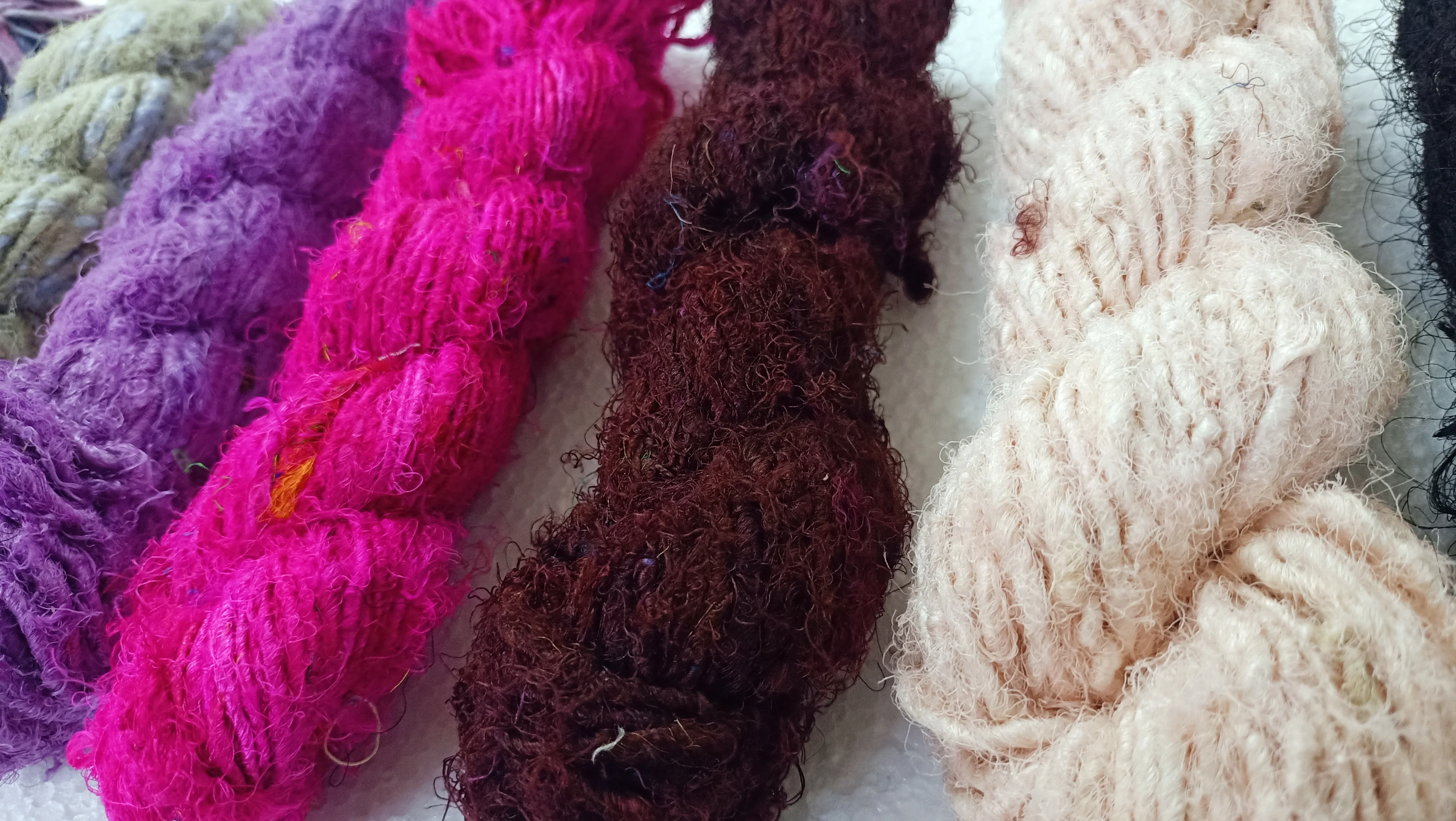 custom made natural and dyed banana an sari silk yarns made from recycled sari silk and banana silk fibers