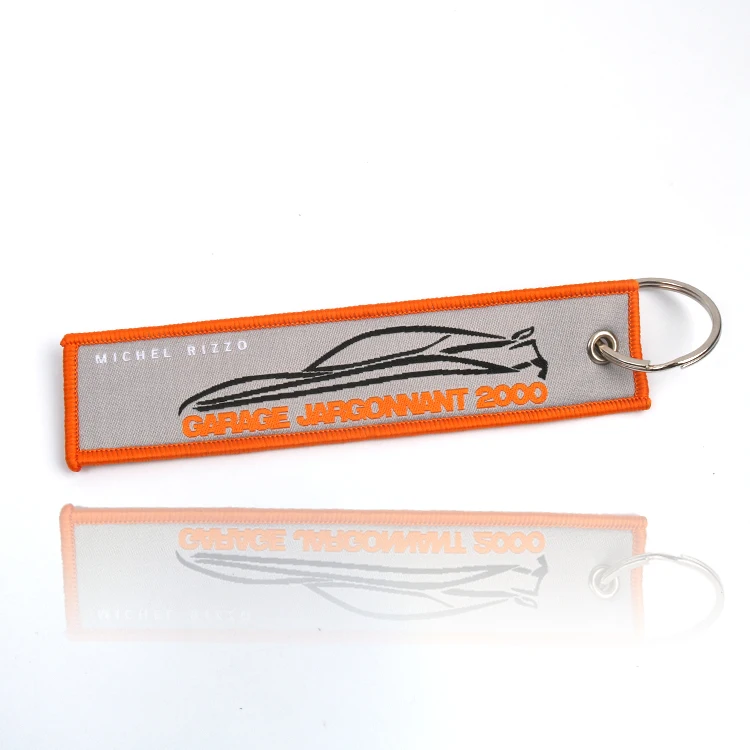 Wholesale Custom Stylish Orange Merrow Border Double Side Name Logo Fabric Labels Plain Woven Car Keychains