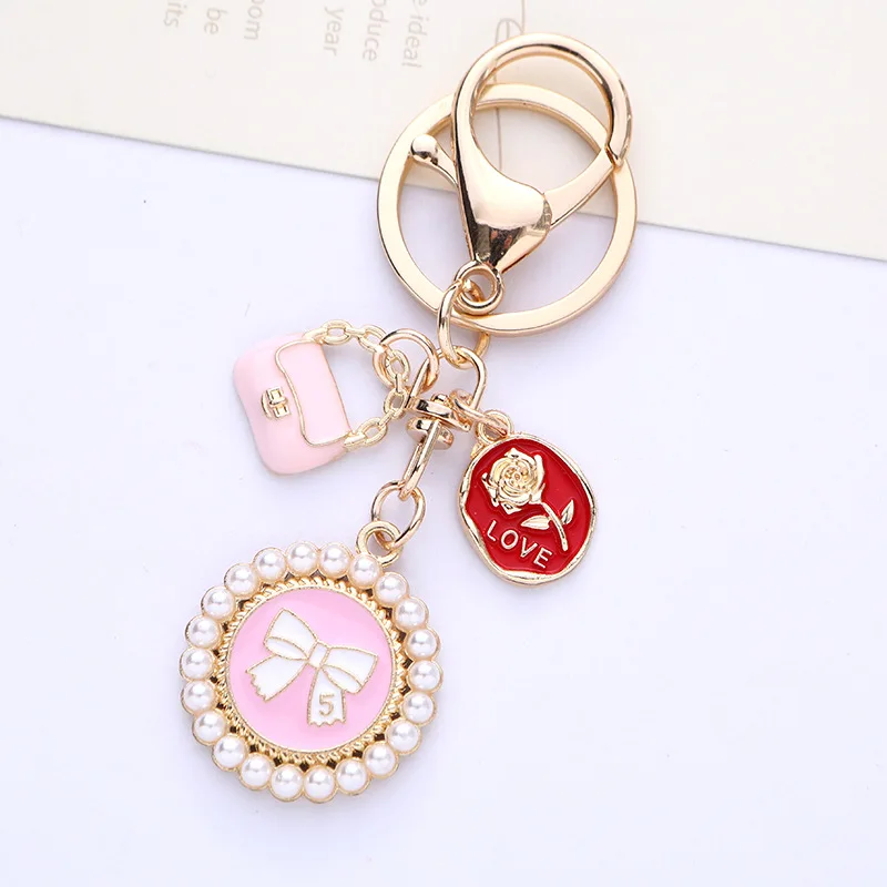 Cute bow Pearl Keychain pendant Creative Rose Bag Accessories Fashion key chain headphone cover bag decoration