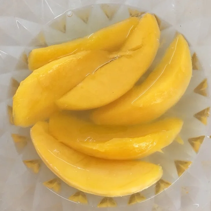 VIETNAM CANNED KAEW MANGO SLICES PULP IN LIGHT SYRUP A10 TINS, CHOICE QUALITY, YELLOW COLOR, OEM PACKING FROM OWN MANUFACTURER