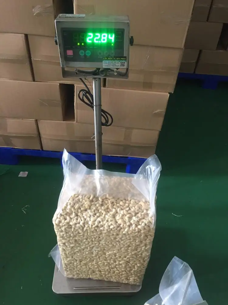 VIETNAM RAW DRY CASHEW NUTS KERNELS - SWP -  small White Pieces grade - Packaging in PE  vacucuum, Tin /Cartons