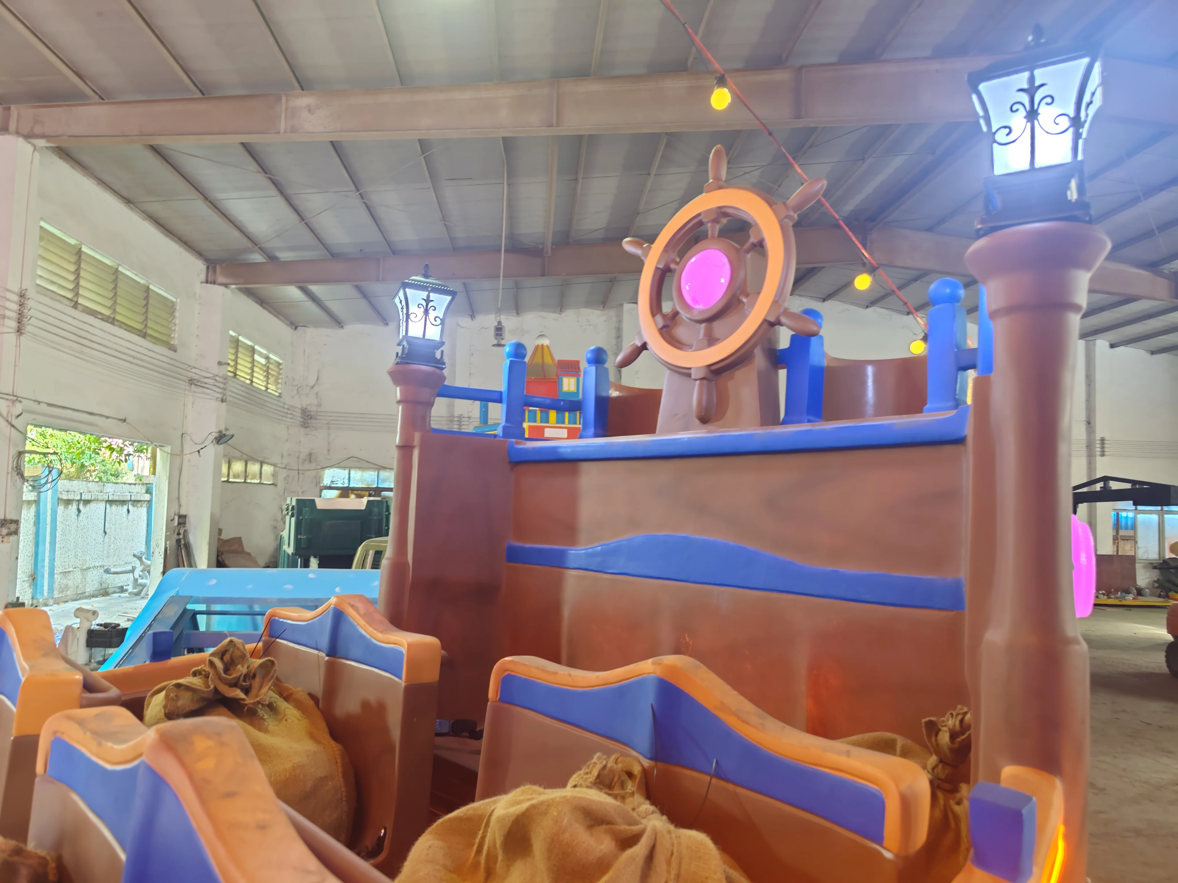 Brightly coloured and brightly lit amusement park rides new pirate ship flying car for adults for sale