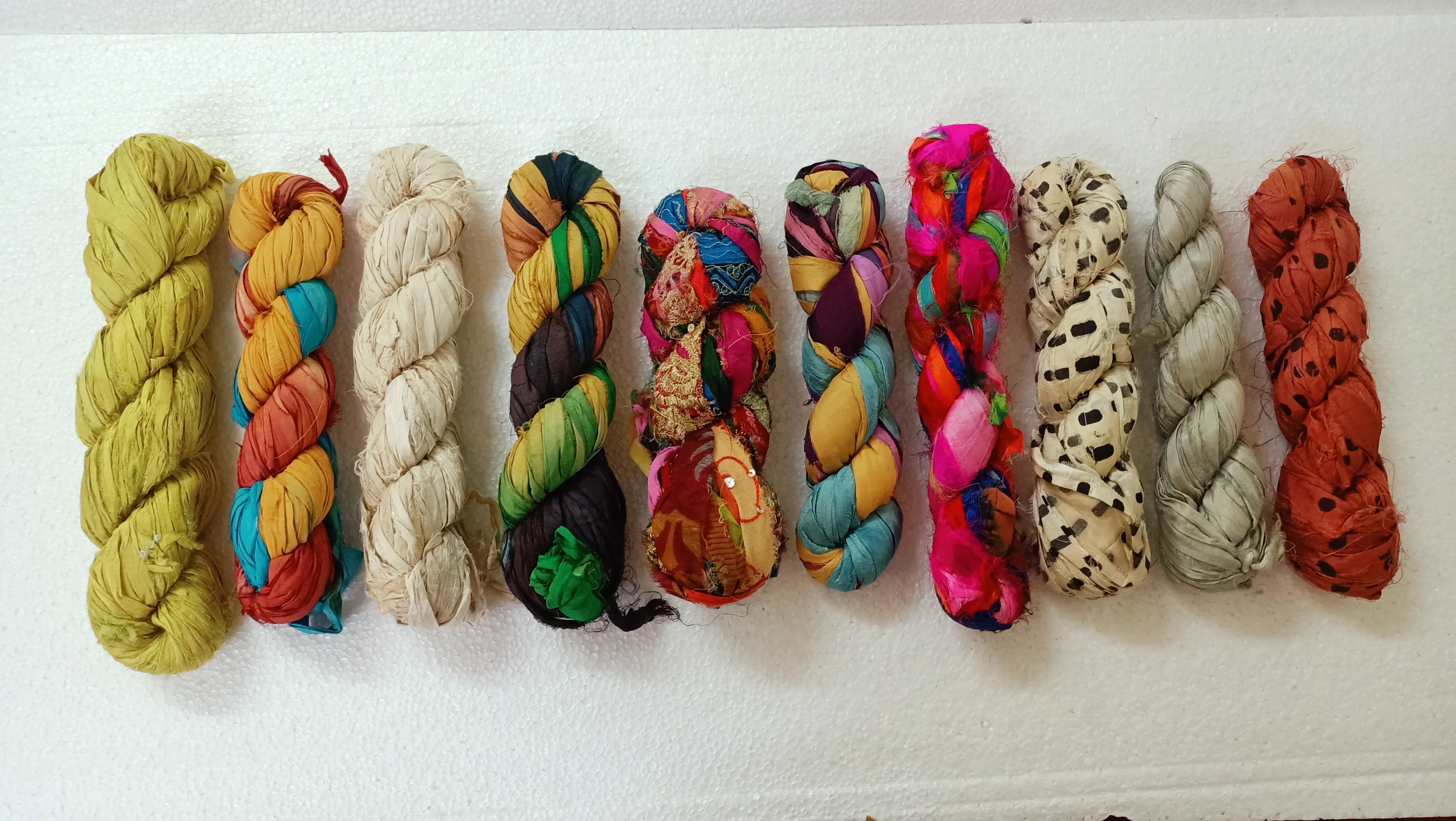 custom made natural and dyed banana an sari silk yarns made from recycled sari silk and banana silk fibers