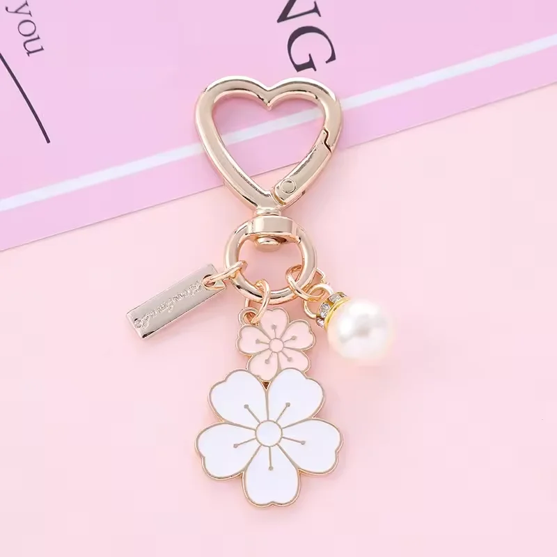 Korean version creative camellia Flower Pearl charm Keychain bag car Phone Earphone Case Decor pendant gift flower key chains