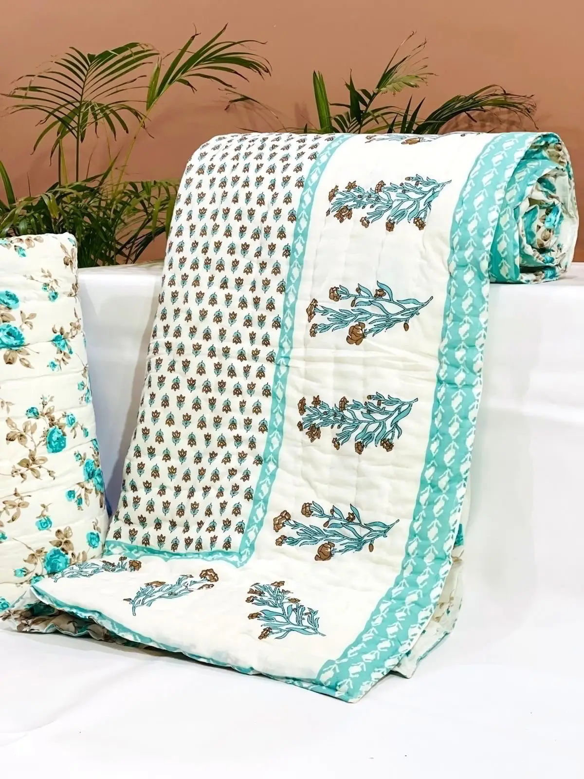 custom made 100% cotton quilts in different designs & various sizes on blue base fabric & multi colour print.
