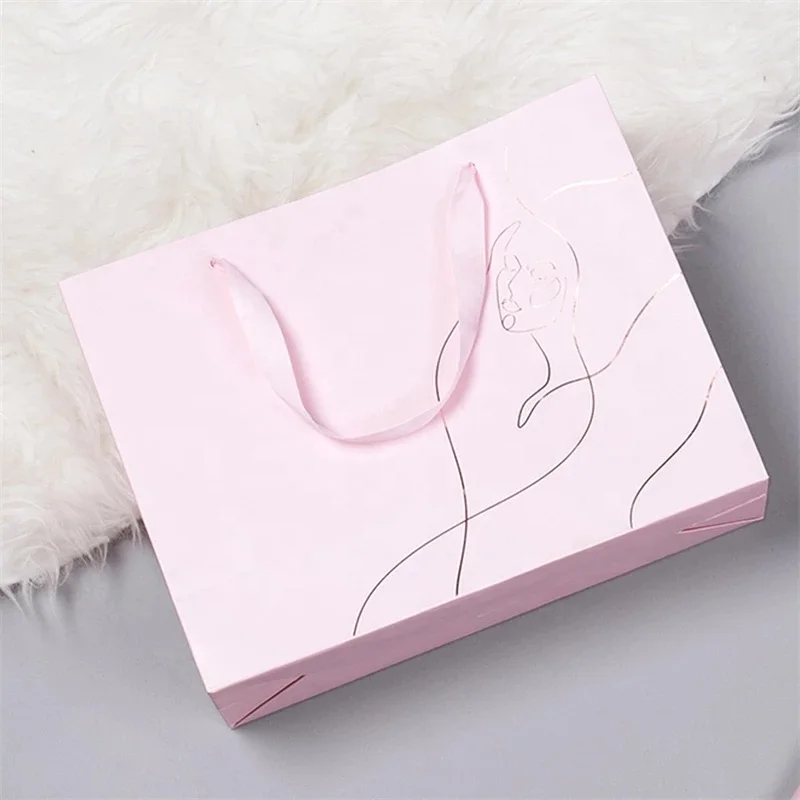 Printed Pink Elegant Brand Logo Luxury Boutique Shopping Paper Bag Custom Logo White Paper Gift Bags With Ribbon Handles