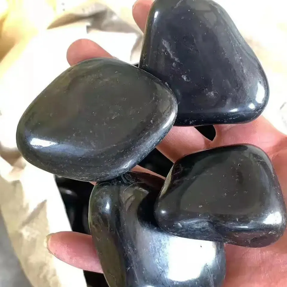 Polished river rocks black pebble stone for landscaping, river pebbles