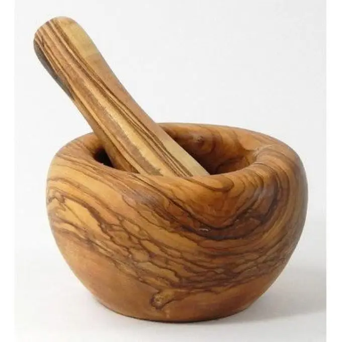 Wooden Mortar and pestle, ancient device for milling by pounding The mortar is a durable bowl commonly made of Wood  Mango