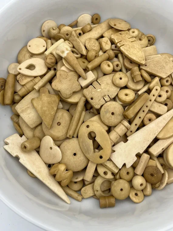 hand carved bone beads in assorted sizes with holes for jewelry designers and bead stores Buffalo Camel Ox Bone Beads