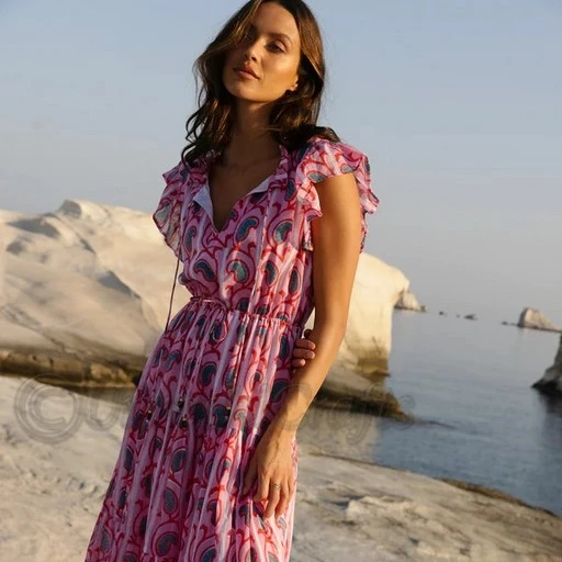 Made from a lightweight cotton voile Fully lined Pullover style Adjustable ties at the waist Flutter cap sleeves