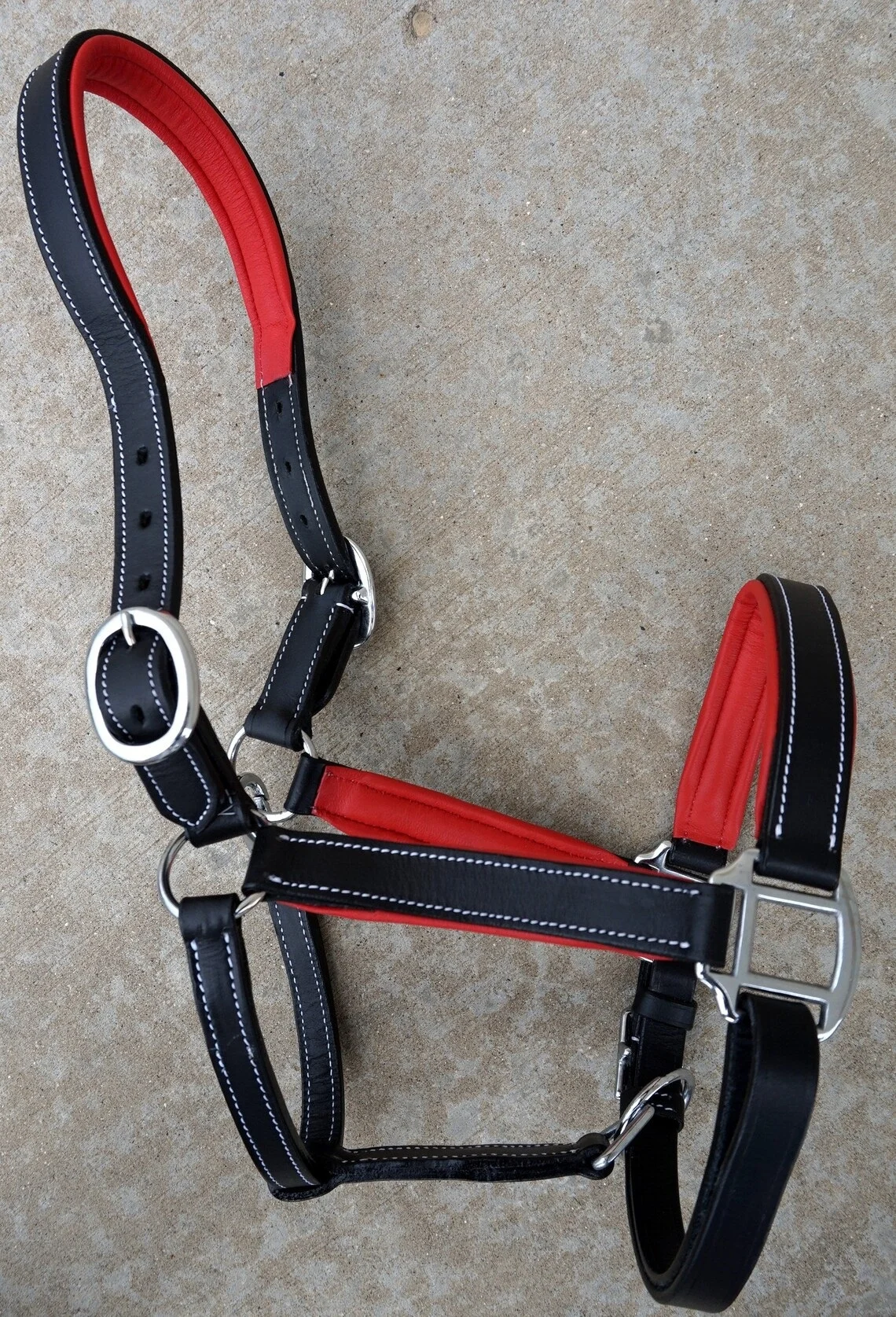 CUSTOMIZED DESIGN LEATHER HALTER WITH CONTRAST COLOR PADDING/ WHOLESALE LEATHER HORSE HALTER WITH PADDING.