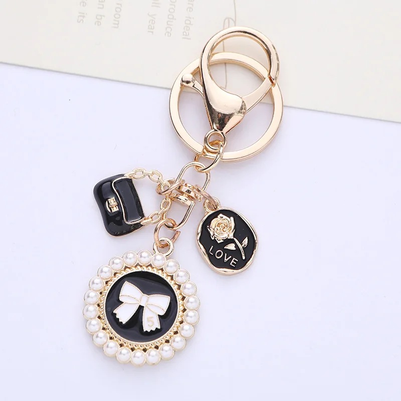 Cute bow Pearl Keychain pendant Creative Rose Bag Accessories Fashion key chain headphone cover bag decoration